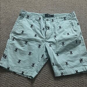 Psycho Bunny Light Green Shorts with Black Bunny Pattern